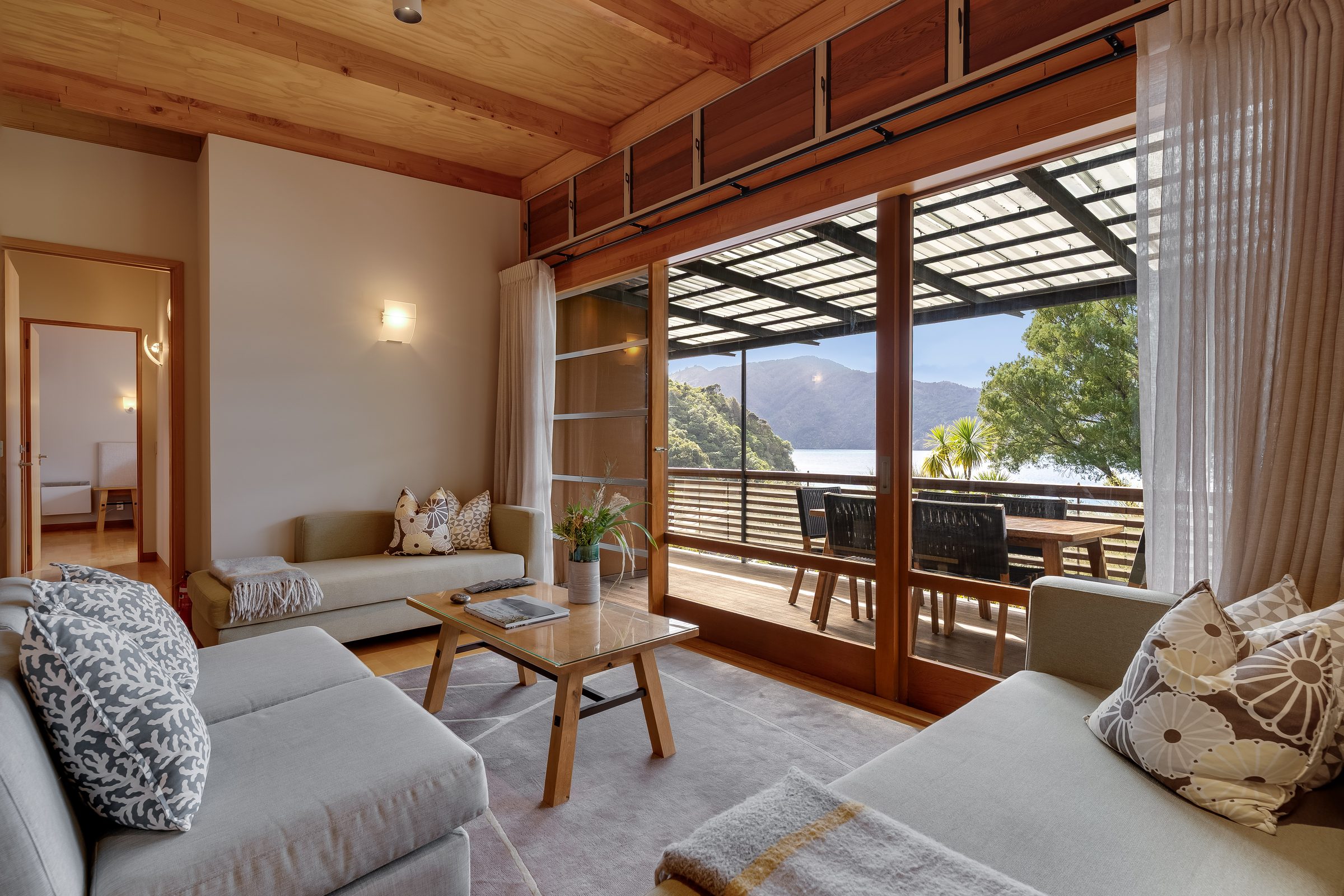 Living room opening to a deck