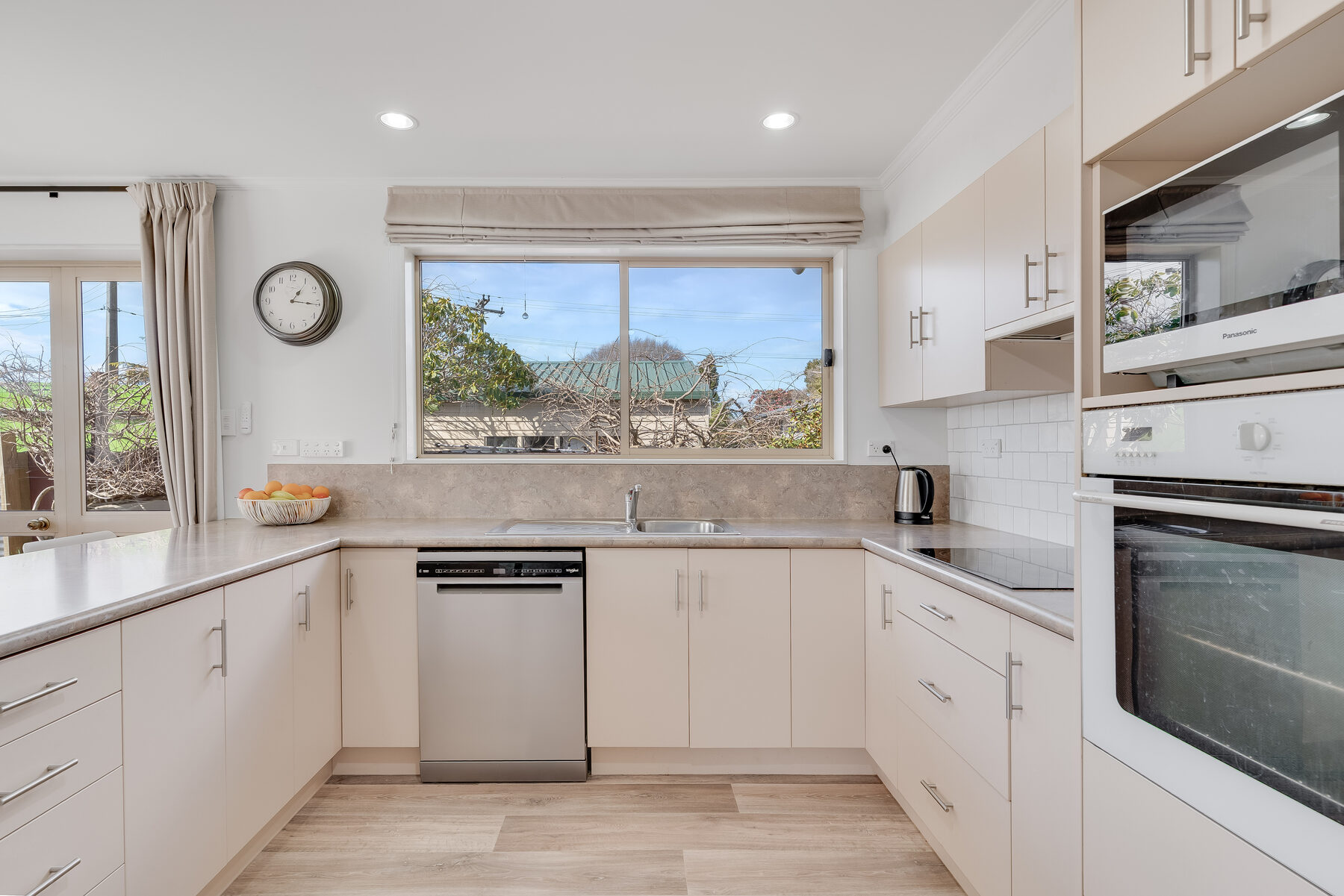 U-shaped kitchen with garden window